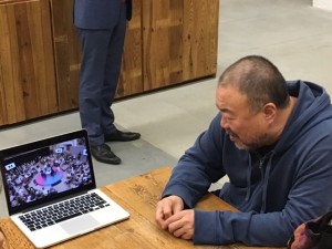 Ai Weiwei watching the 6 Degrees Video at his Studio in Berlin               